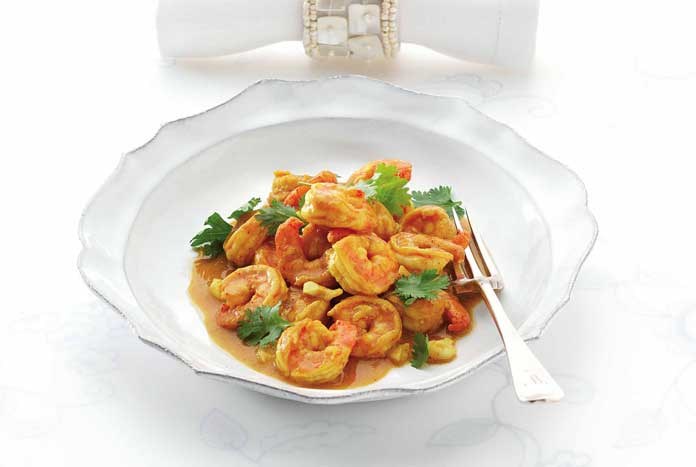 A beautifully presented bowl of Indian food: fragrant king prawn curry.