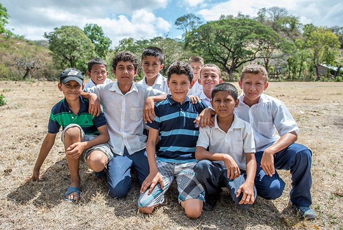 A group of young boys smiling for the camera in rural Nicaragua.
