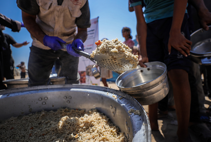 Food being prepared for distribution in Gaza by Ma'an Development