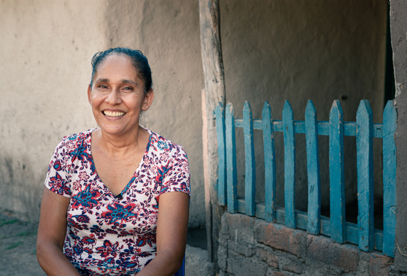A woman smiles for the camera in rural Nicaragua.