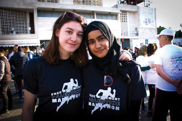 Two young women at the starting line of the Palestine Marathon 2017 in Bethlehem.