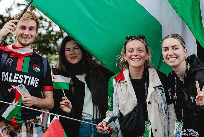 A crowd of young people waving Palestine flags supporting the Gaza Sunbirds at the World Cycling Championships in Zurich in September 2024.