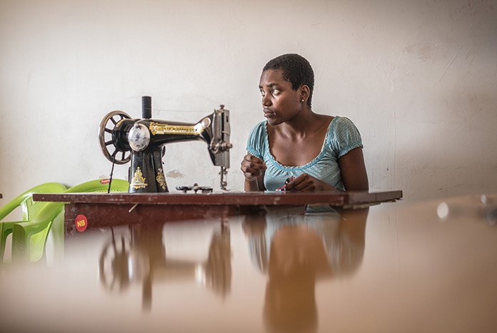 A young Tanzanian women with her sewing machine.