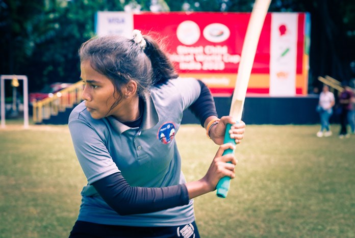 Monisha from Chennia, India, batting for her team in the 2023 Street Child Cricket World Cup.