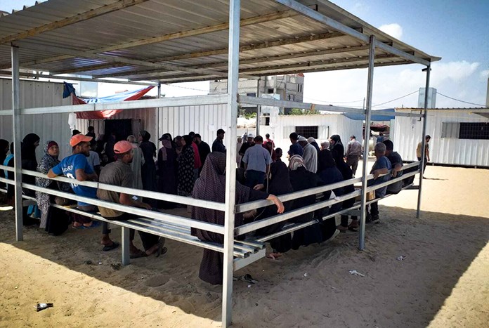 Patients wait to see doctors from Al Ahli Hospital in Gaza City.