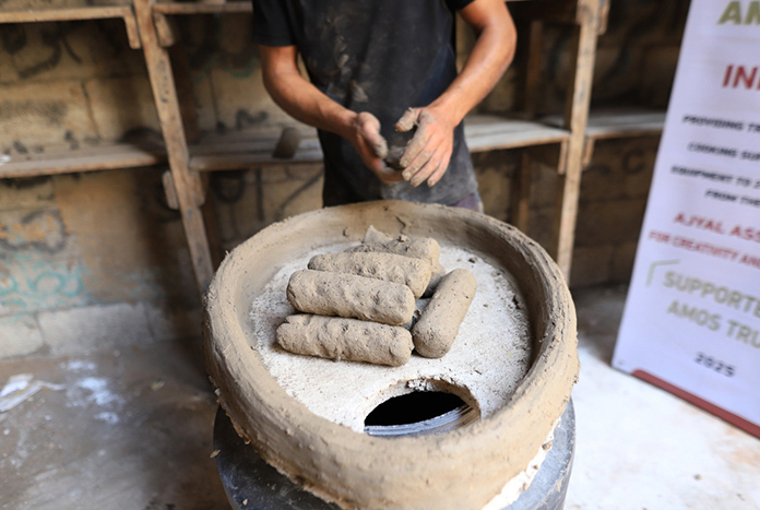 A hand-made bread oven being built in Gaza.
