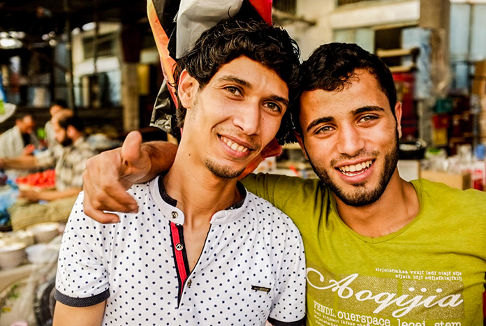 Two young men at a fruit market in Gaza City.