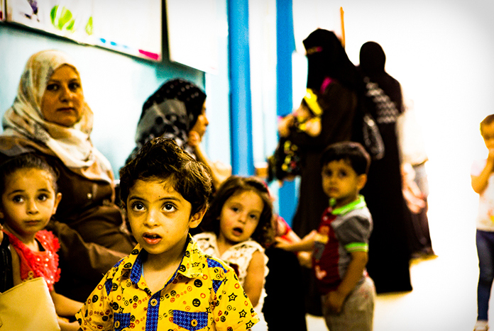 Young children attending a family health clinic in Gaza City