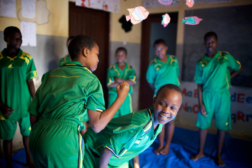 Girls from Cheka Sana Tanzania enjoying a self-defence class.
